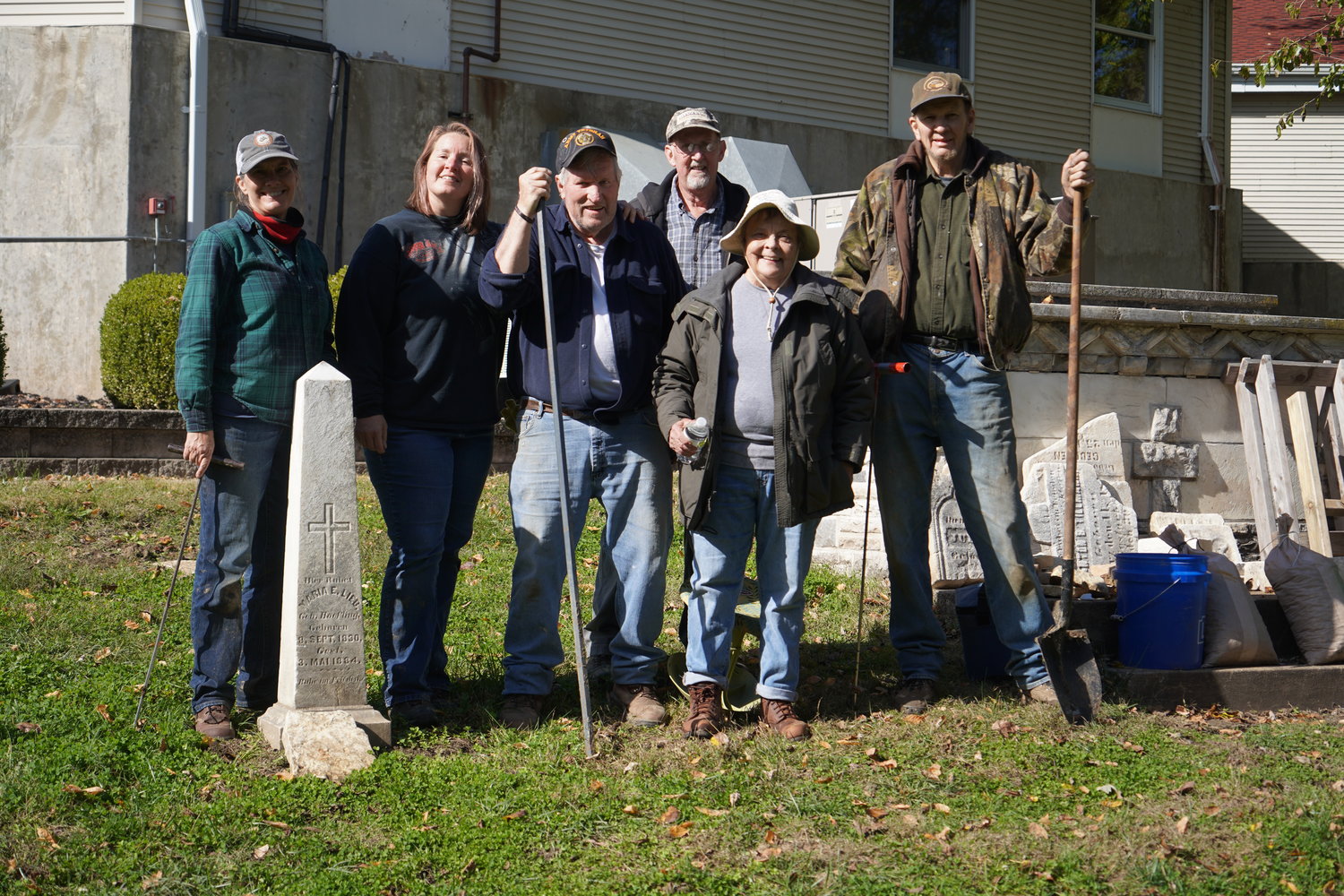 A group of volunteers who restore old cemeteries uncovers a headstone foundation they discovered while probing the ground of St. Peter Cemetery #1 in Jefferson City, with burials dating from the 1850s to the 1880s.